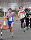 Brian Rushworth (Sunderland) can't hold off the Gateshead athlete in the senior mens Elswick Road Relays.